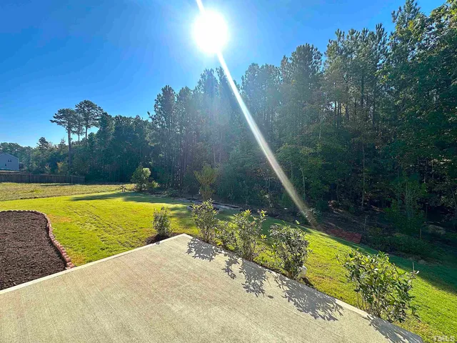 a view of a swimming pool with an outdoor space and seating area