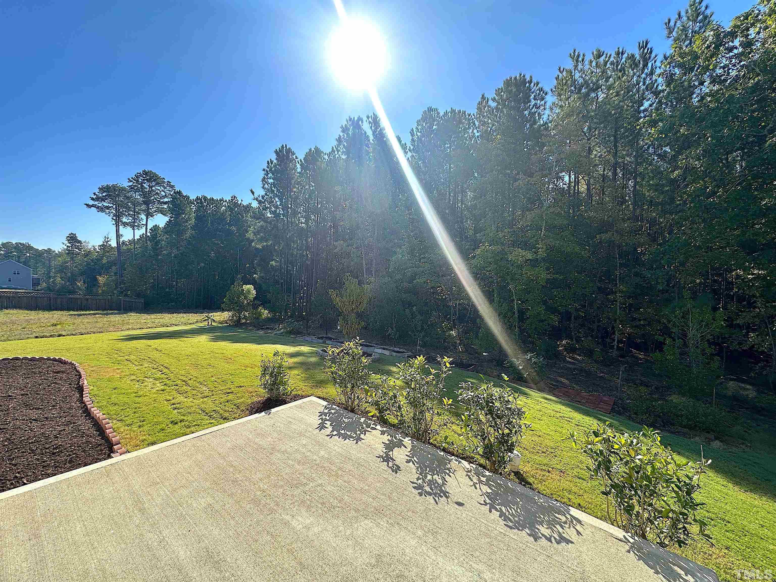 205 Azalea View Way Holly Springs, NC 27540 - Photo 28 of 29 a view of a swimming pool with an outdoor space and seating area