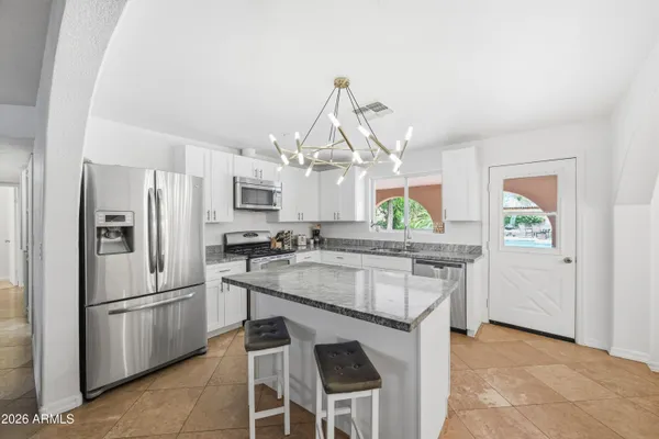 a dining room with a table and chairs
