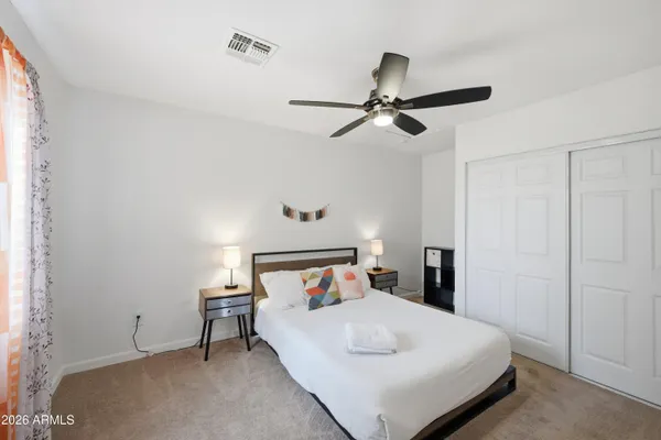 a balcony with table and chairs