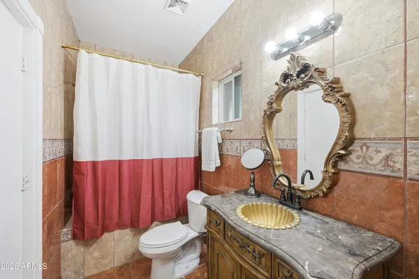 a view of empty room with wooden ceiling