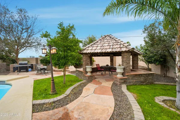 a view of a swimming pool with a patio
