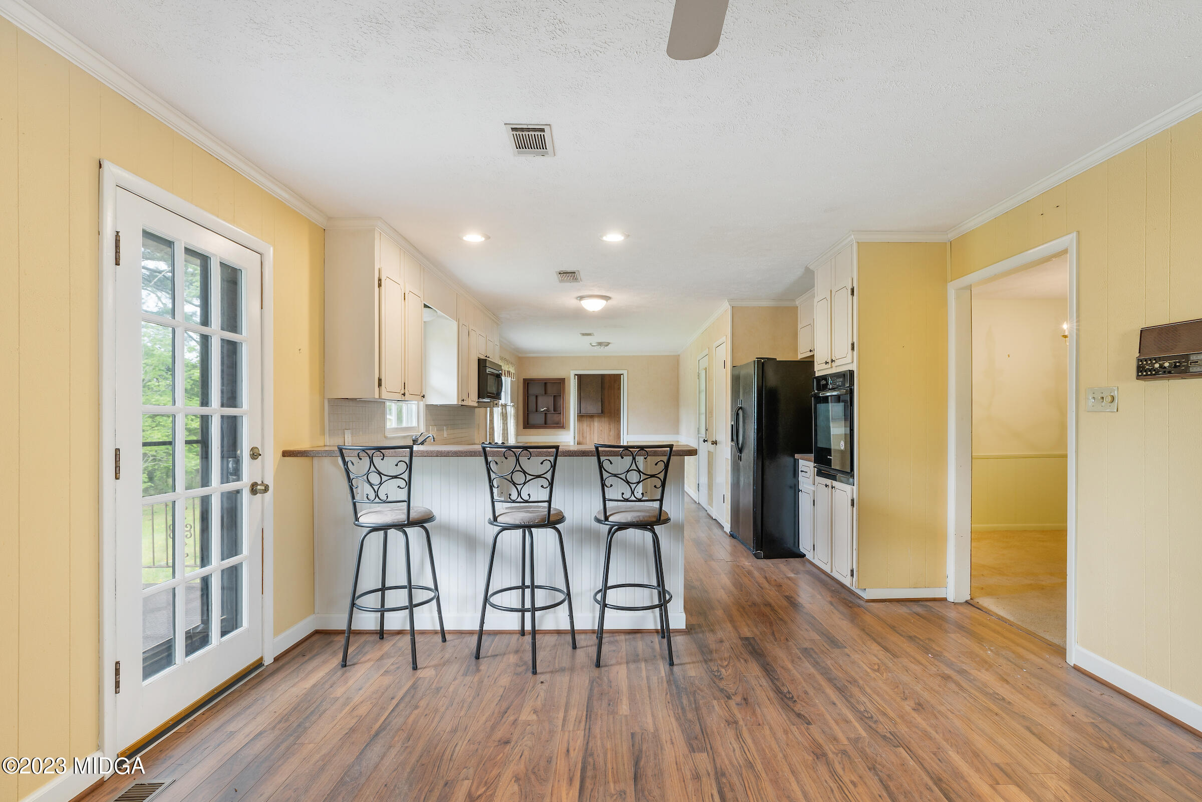 200 Gunters Mill Road Byron, GA 31008 - Photo 27 of 44 a view of a dining room with furniture and wooden floor