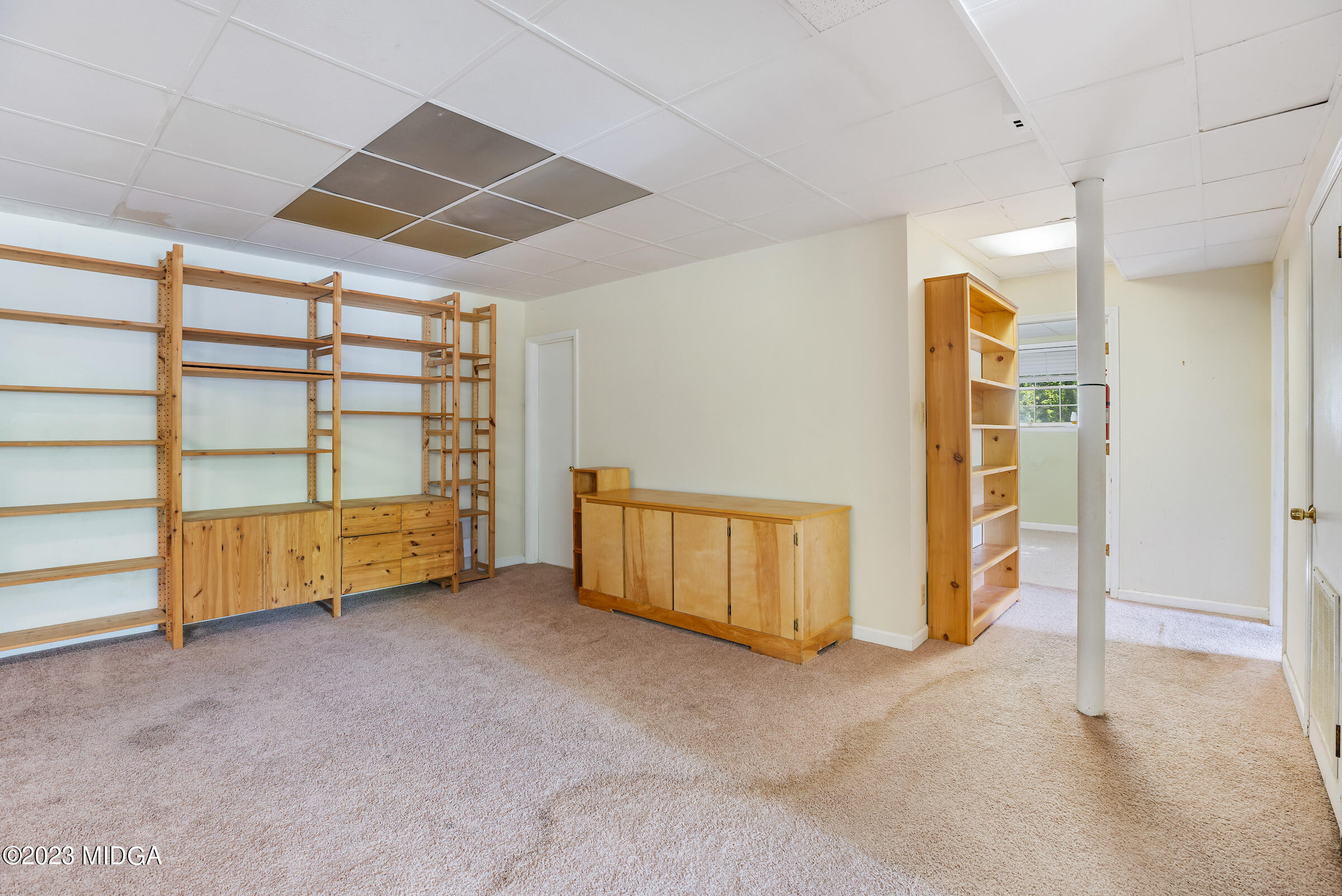 200 Gunters Mill Road Byron, GA 31008 - Photo 39 of 44 an empty room with furniture and natural light