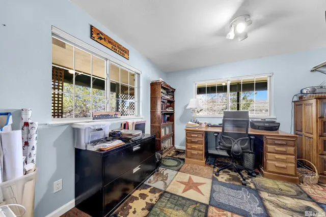 a workspace with furniture and window