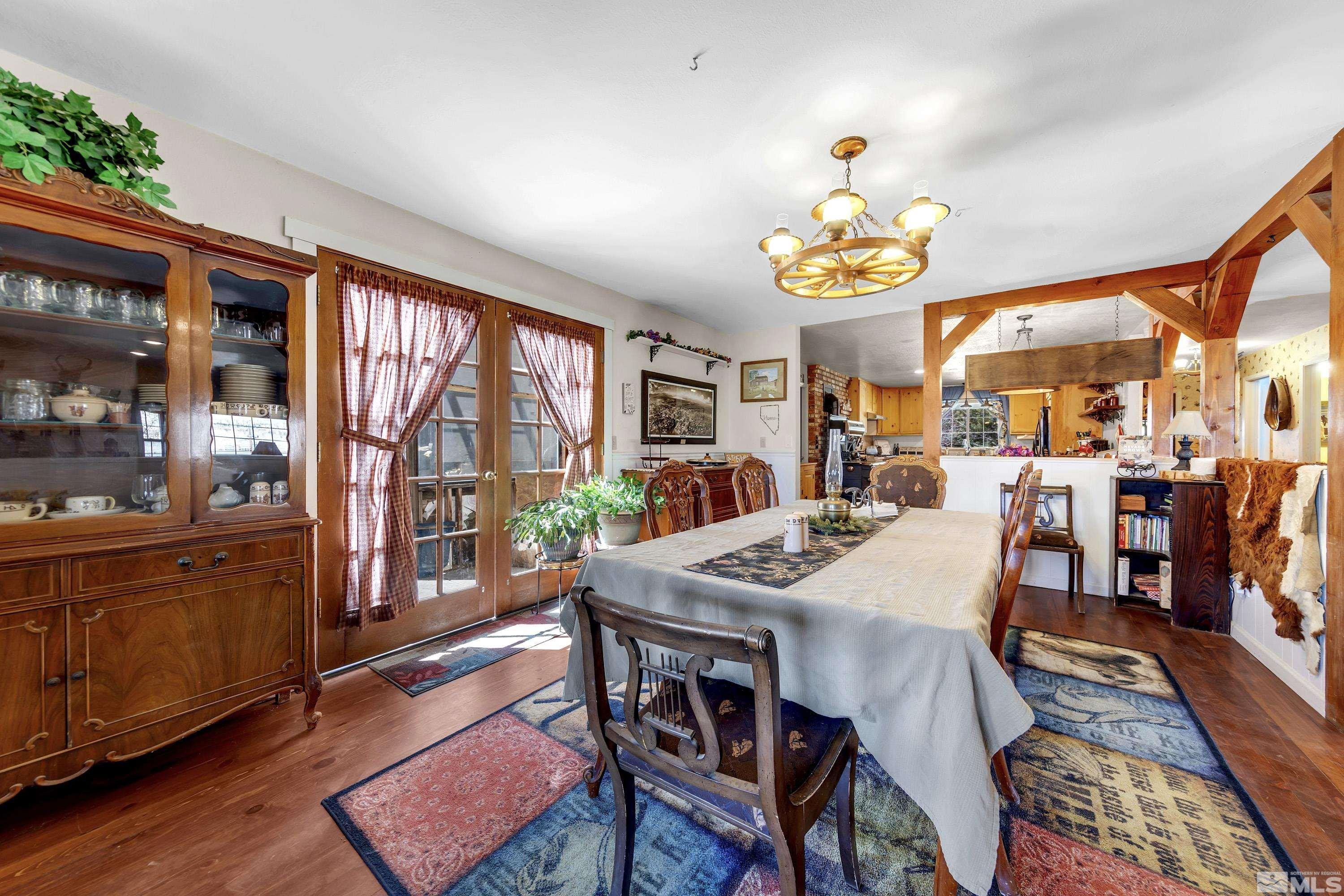 3380 Mario Road Reno, NV 89523 - Photo 17 of 40 a view of a dining room with furniture window and wooden floor