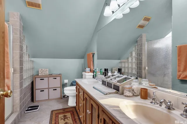 a bathroom with a sink a vanity and a mirror