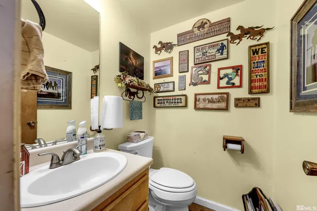 a bathroom with a sink a mirror and a toilet
