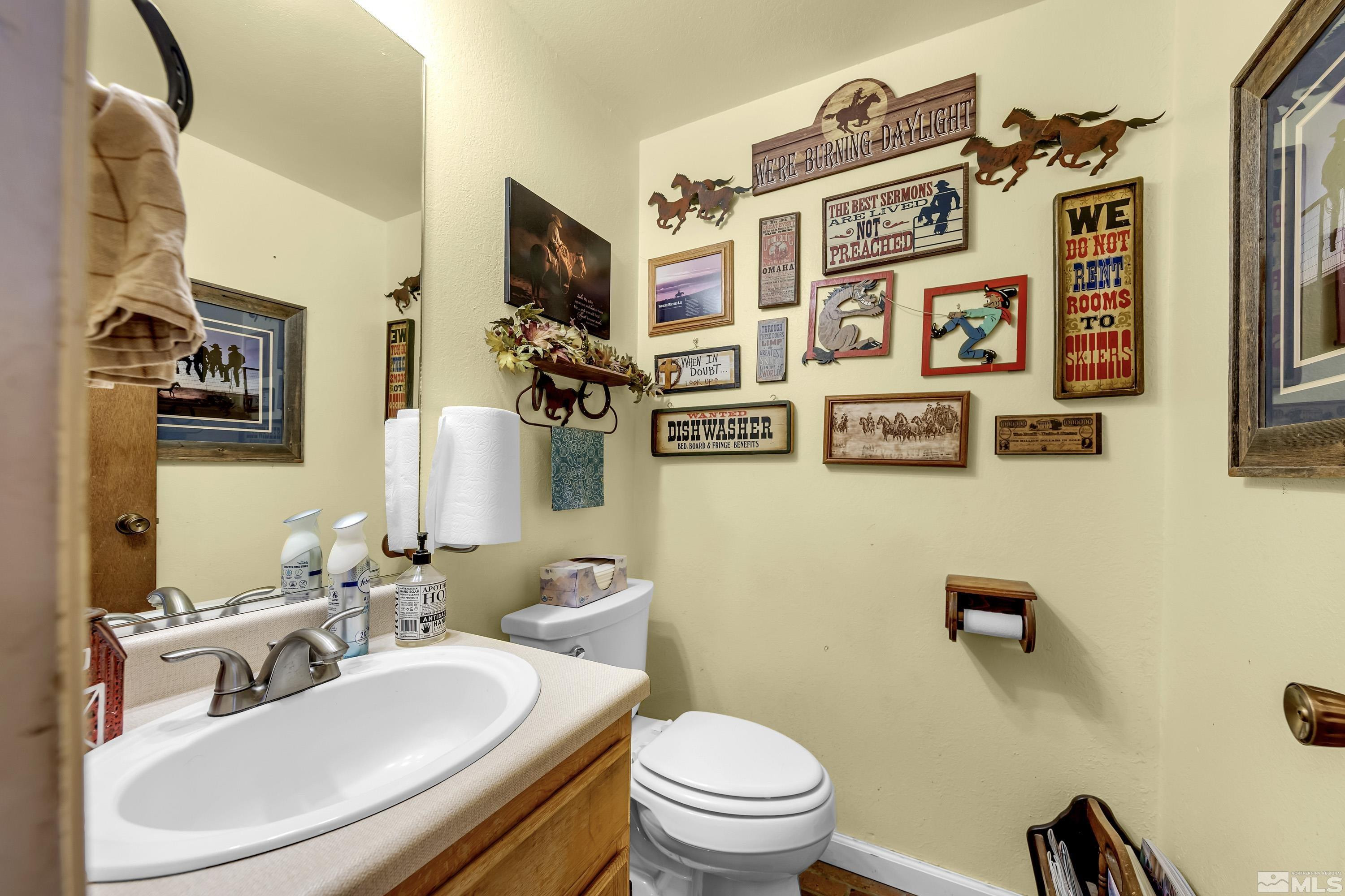 3380 Mario Road Reno, NV 89523 - Photo 21 of 40 a bathroom with a sink a mirror and a toilet