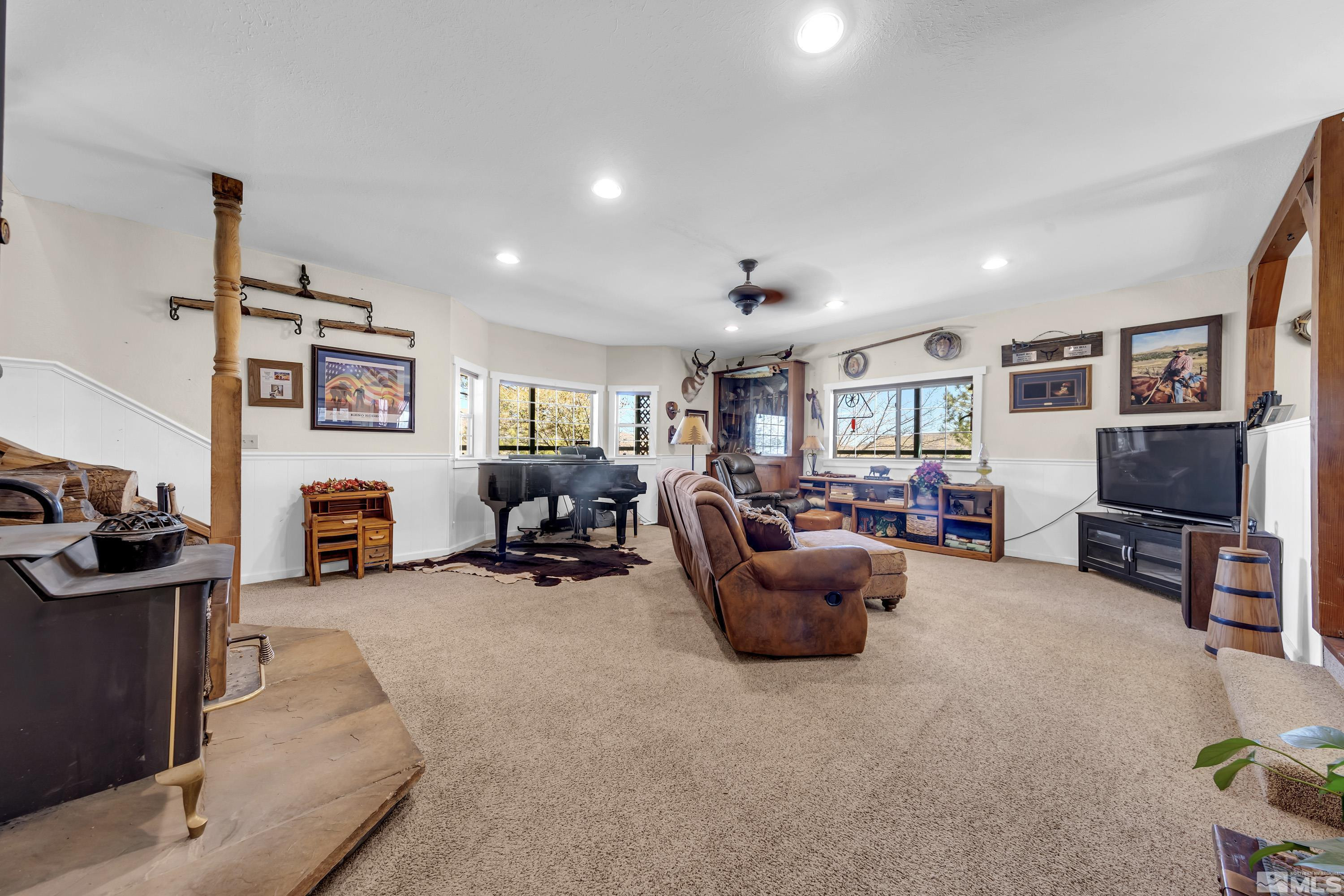 3380 Mario Road Reno, NV 89523 - Photo 22 of 40 a living room with furniture and a flat screen tv