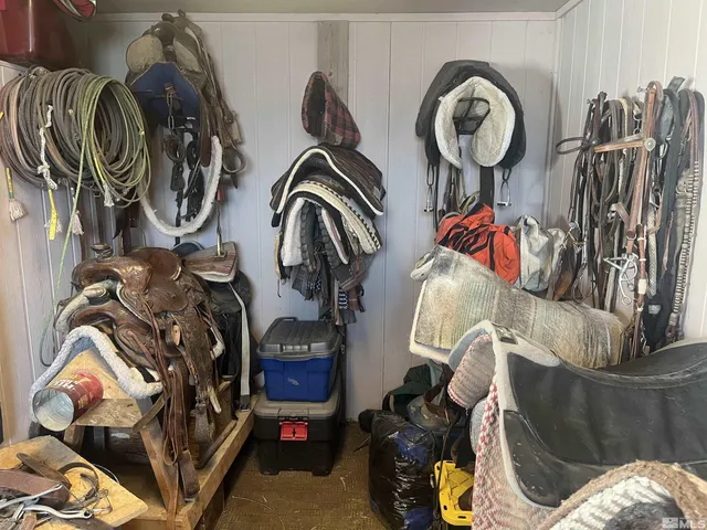 a view of walk in closet with clothes