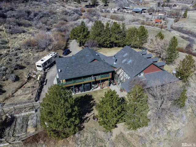 an aerial view of houses with yard