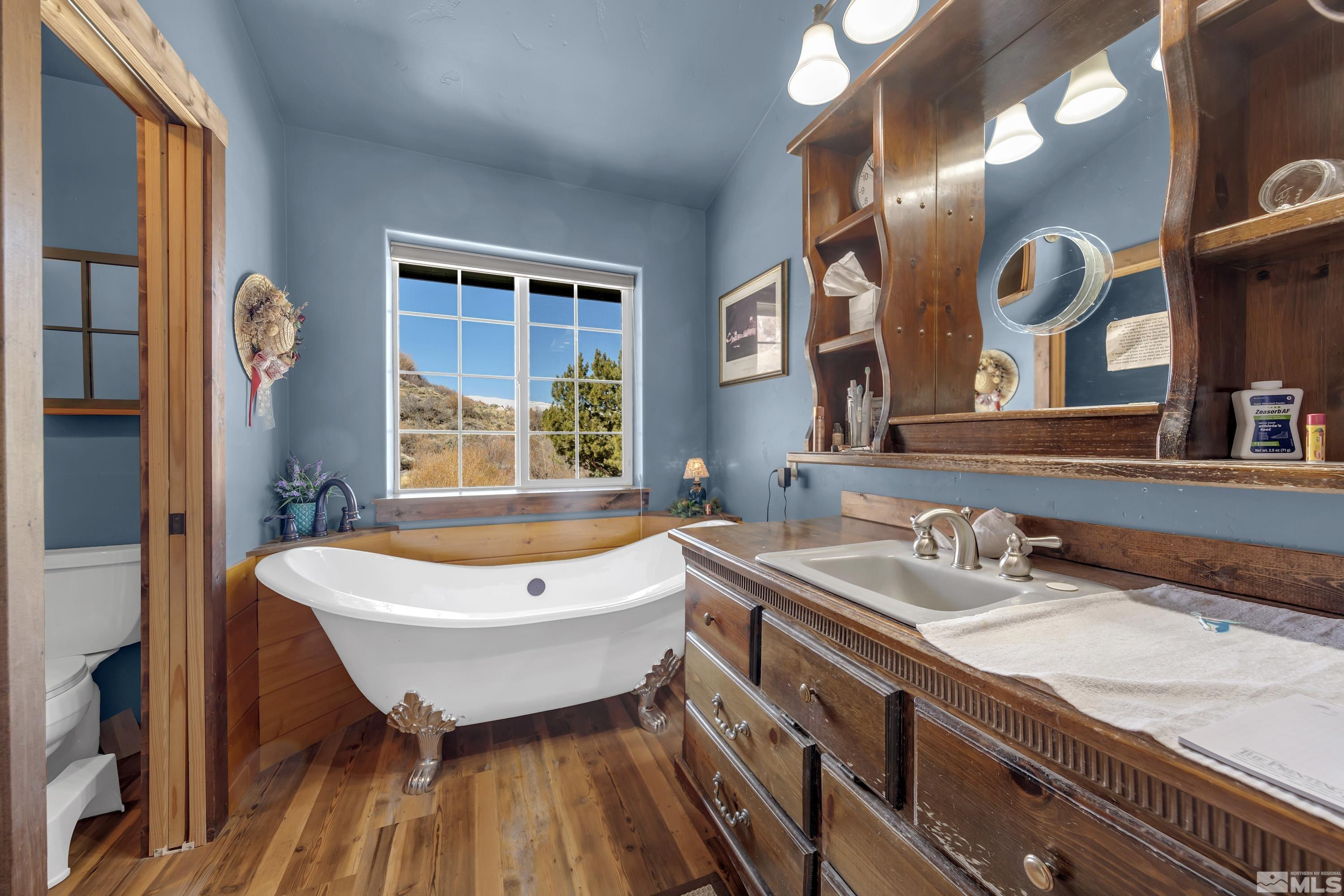 3380 Mario Road Reno, NV 89523 - Photo 34 of 40 a bathroom with a granite countertop sink a mirror and a bathtub