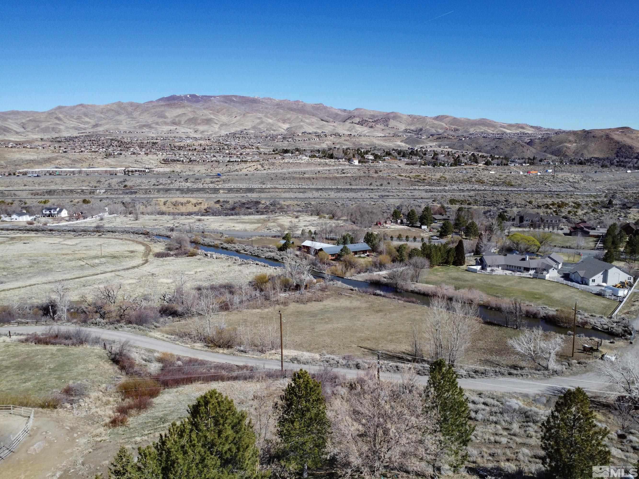 3380 Mario Road Reno, NV 89523 - Photo 36 of 40 a view of a town with mountains in the background