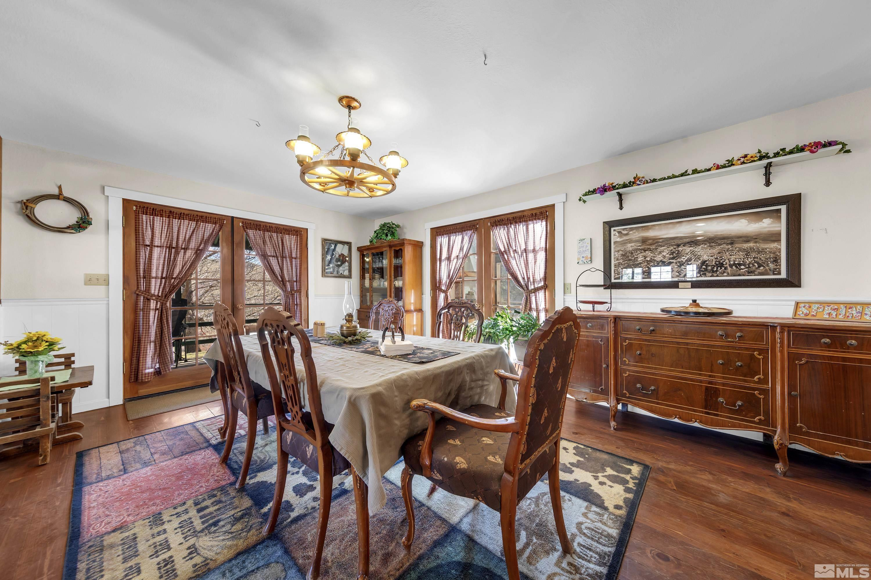 3380 Mario Road Reno, NV 89523 - Photo 7 of 40 a view of a dining room with furniture window and wooden floor