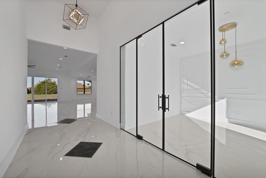 443 Whispering Way Red Oak, TX 75154 - Photo 18 of 36 a view of a hallway with bathroom and a shower
