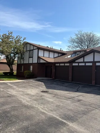 a front view of a house with a street