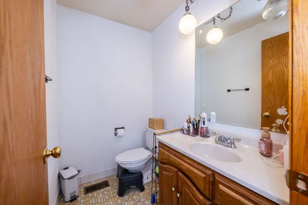 a view of a room with a dresser and mirror