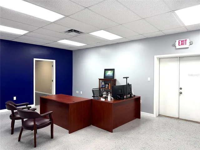 a room with furniture and a mirror