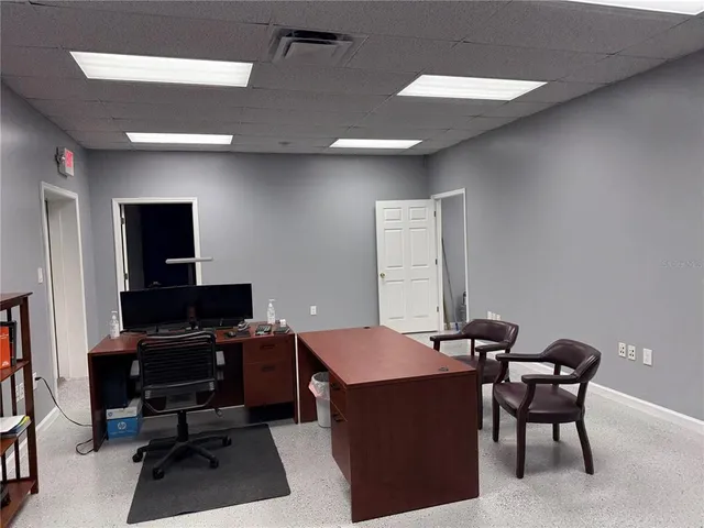 a view of a workspace with furniture