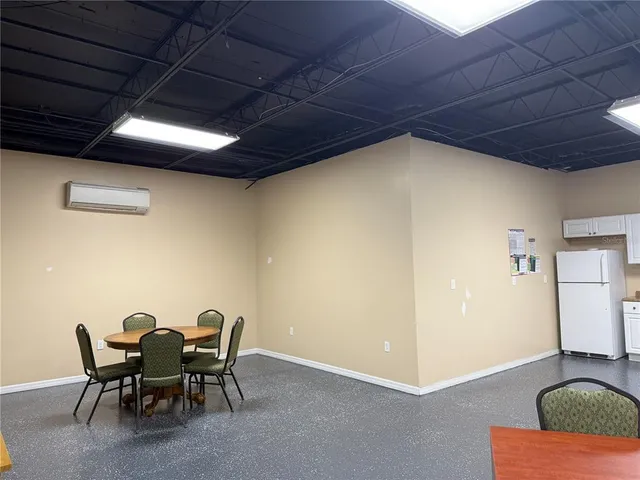 a view of a livingroom with furniture and a table & chairs