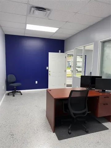 a view of a workspace with furniture