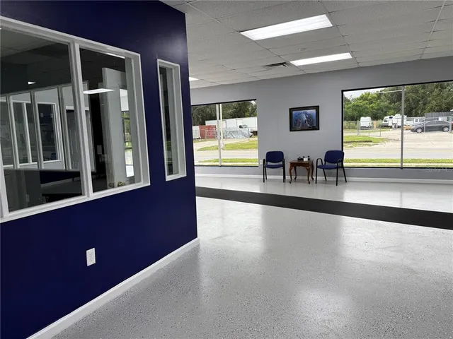 wooden floor in a hall with a window