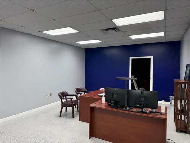 a view of a workspace with furniture