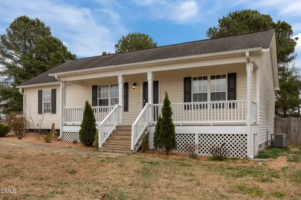 a front view of a house with a garage