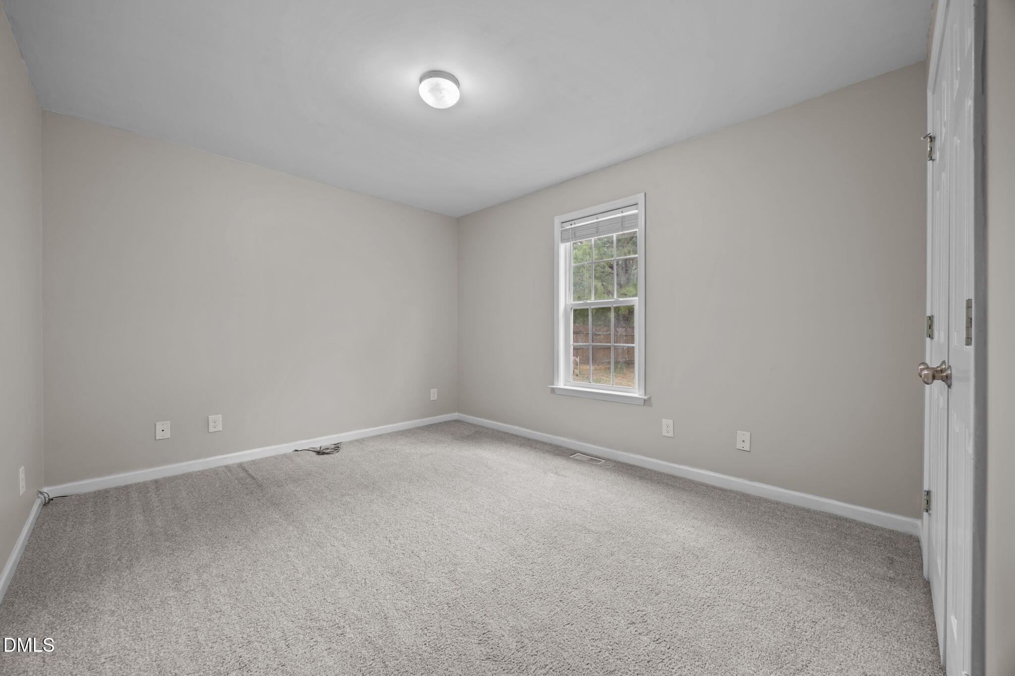 24 Sue Drive Angier, NC 27501 - Photo 15 of 39 an empty room with a window