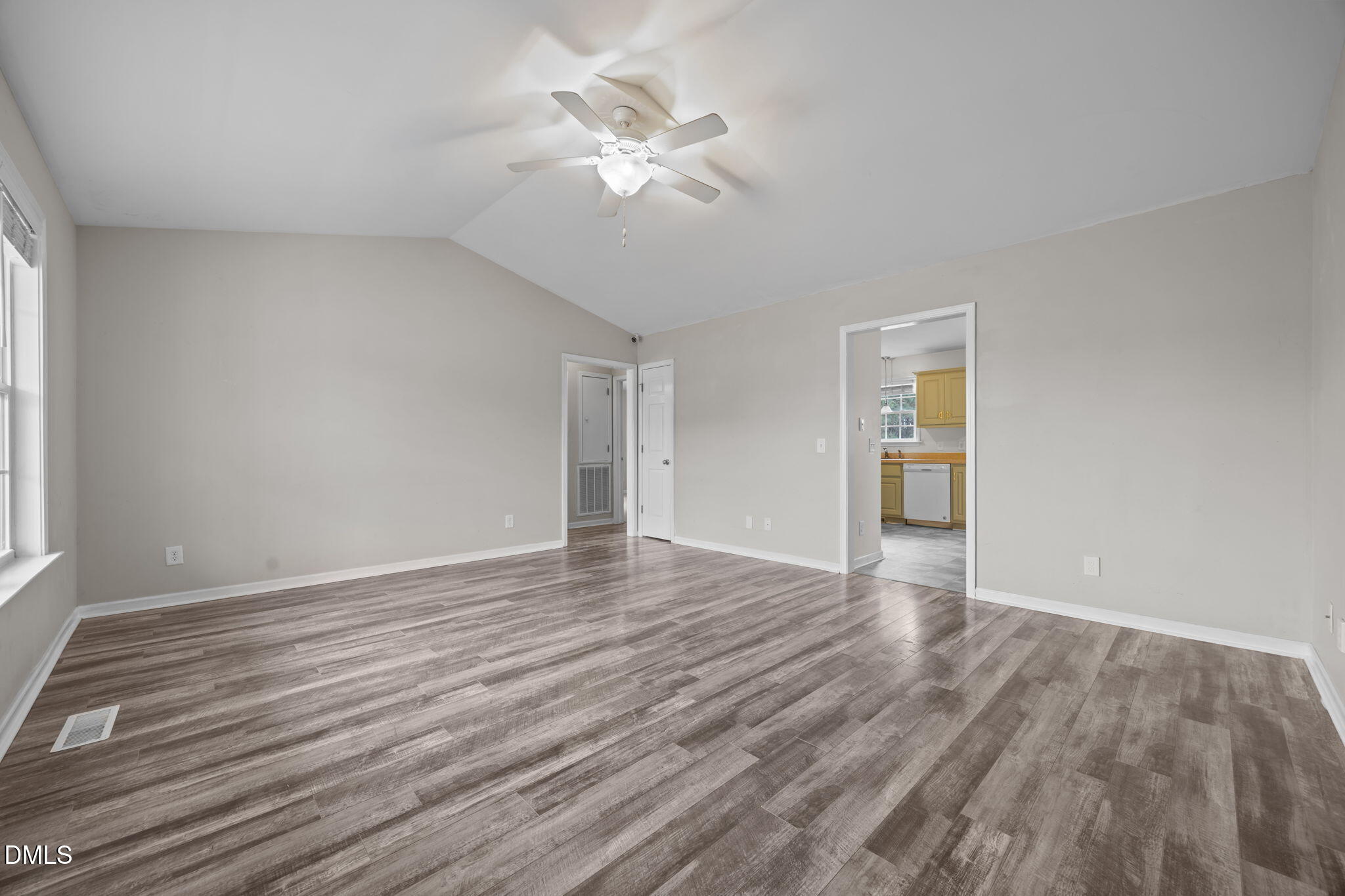 24 Sue Drive Angier, NC 27501 - Photo 23 of 39 a view of an empty room with wooden floor and a ceiling fan