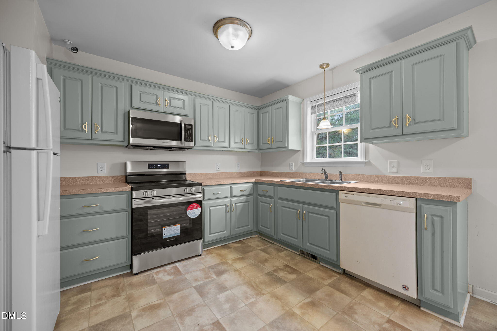 24 Sue Drive Angier, NC 27501 - Photo 6 of 39 a kitchen with stainless steel appliances granite countertop a stove microwave and sink