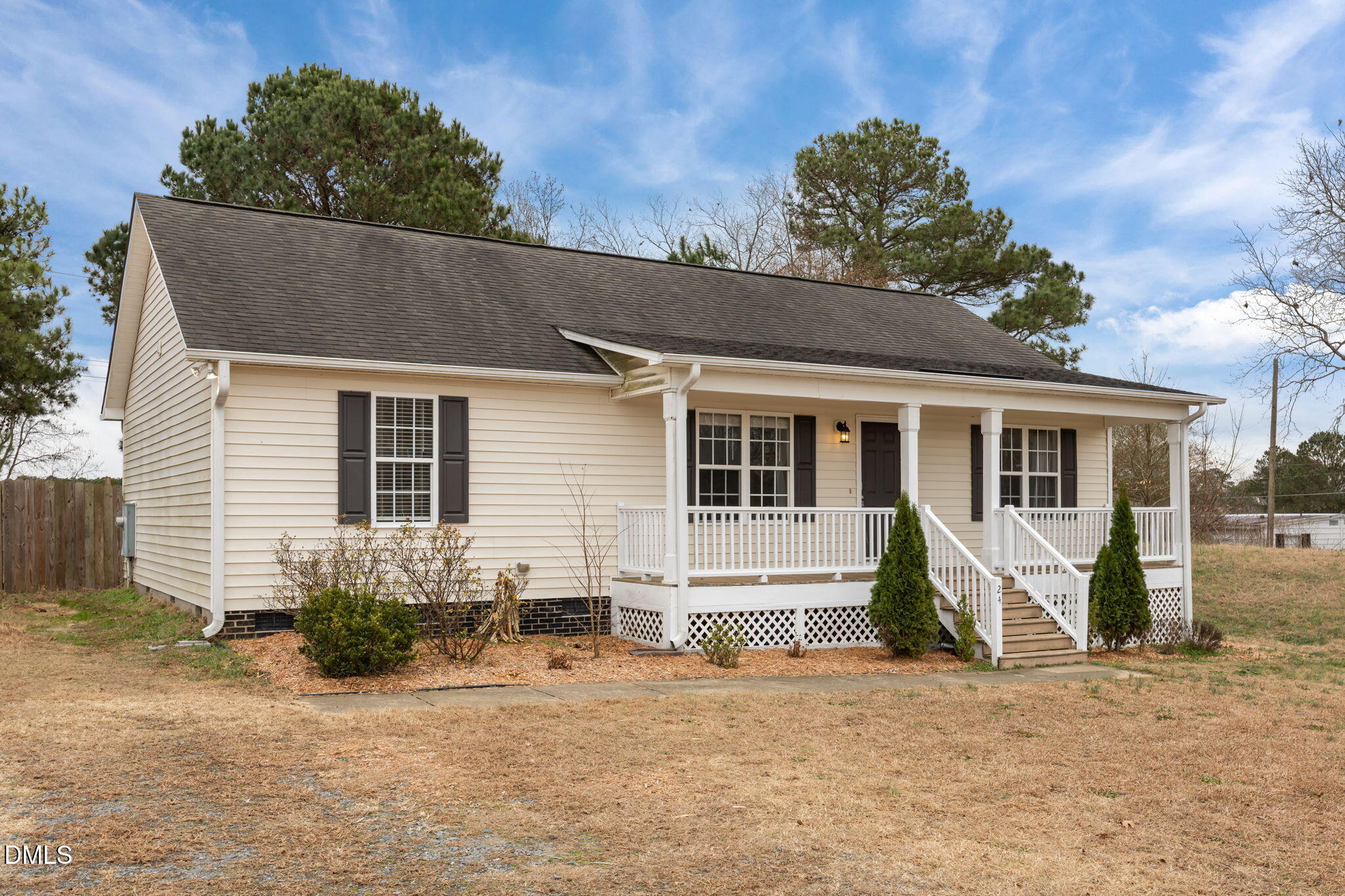 24 Sue Drive Angier, NC 27501 - Photo 7 of 39 a front view of a house with a yard and potted plants