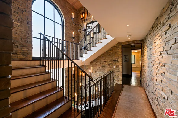 a bedroom with furniture and a fireplace