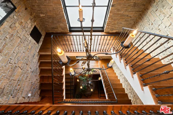 a living room with furniture a couch and a flat screen tv