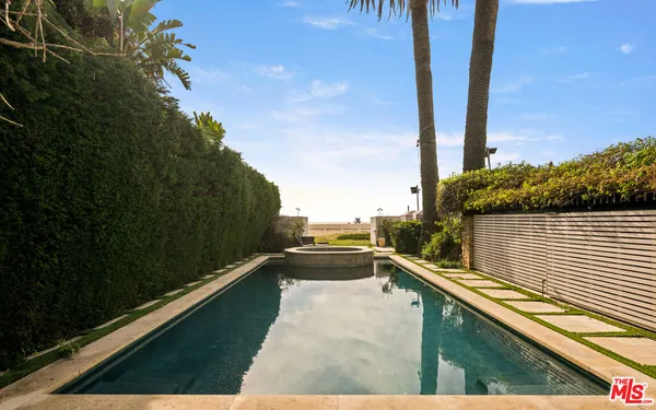 a view of balcony with two yard and outdoor seating