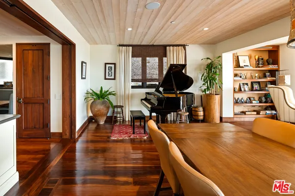 a view of a dining room with furniture window and outside view
