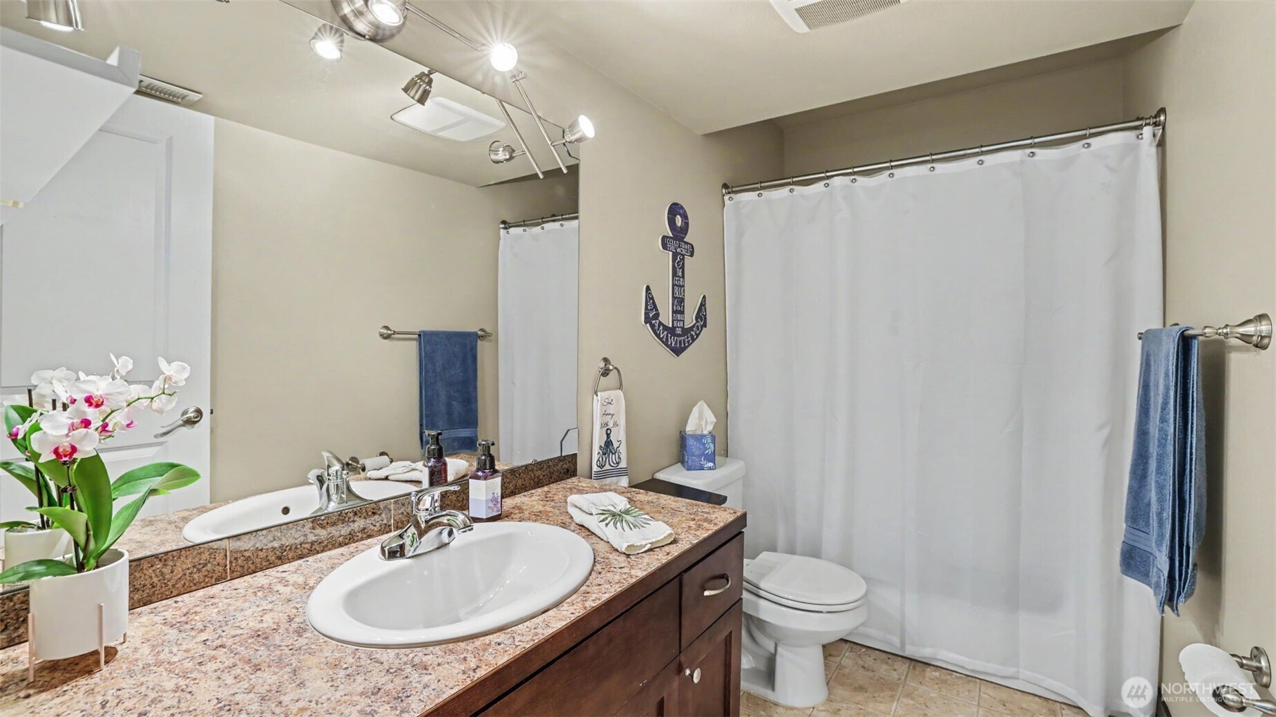 1357 Elma Place Northeast Renton, WA 98059 - Photo 36 of 40 a bathroom with a sink toilet and shower
