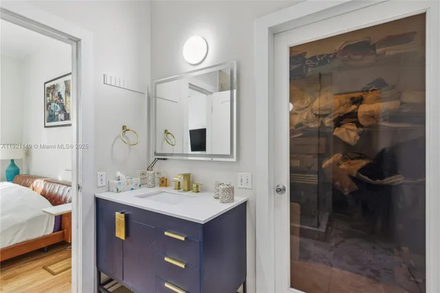 a bathroom with a sink and a mirror