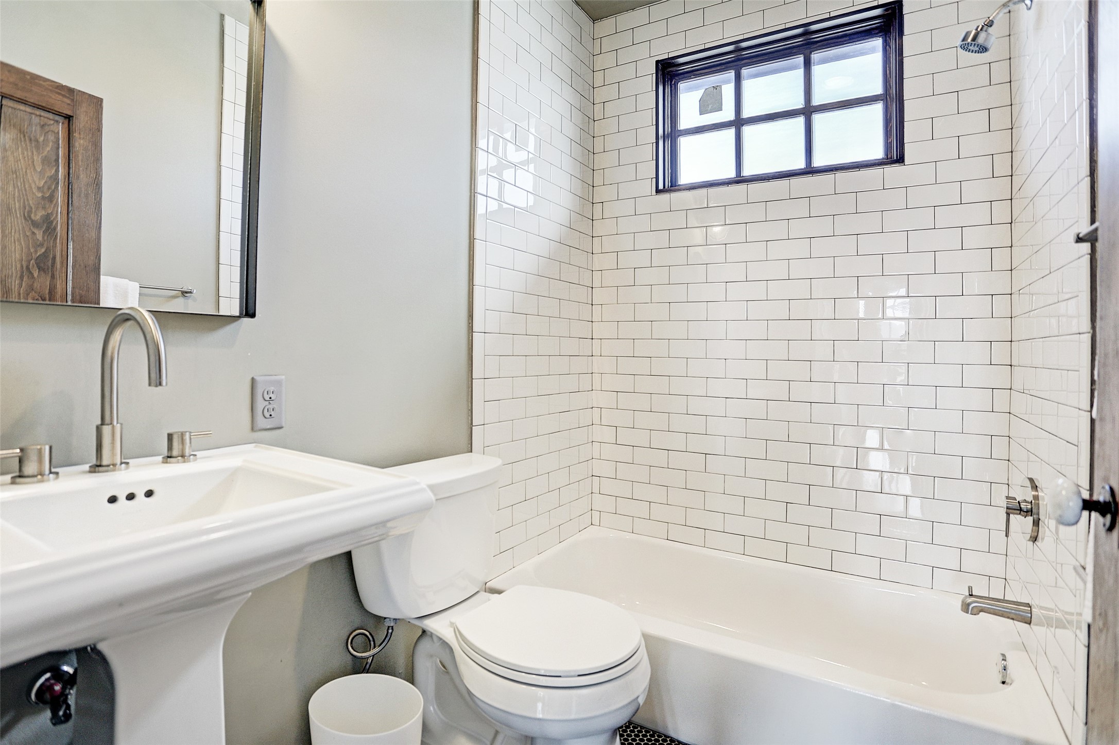 808 Coronado Street Houston, TX 77009 - Photo 28 of 50 Unit 1, third floor full bathroom with tub/shower combo, subway tile, and large window.