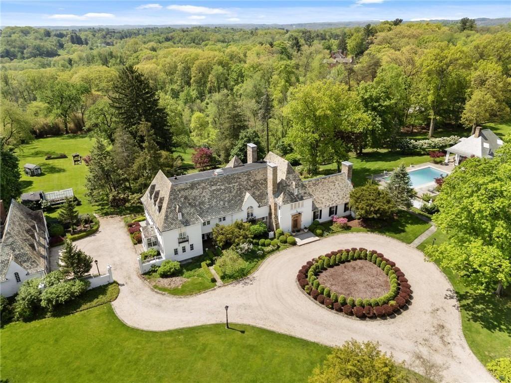 an aerial view of a house with a yard