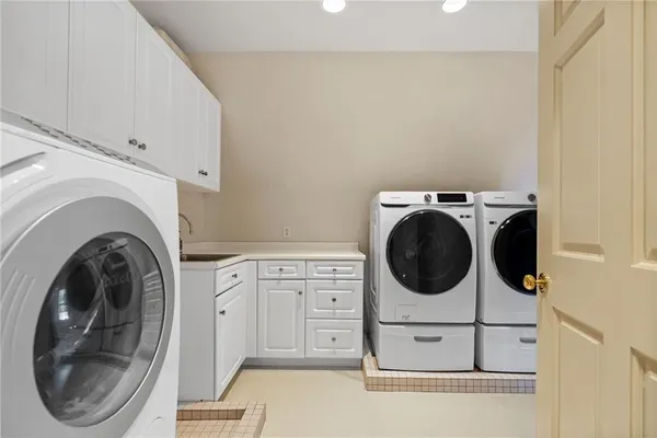 a kitchen with granite countertop a sink and stove