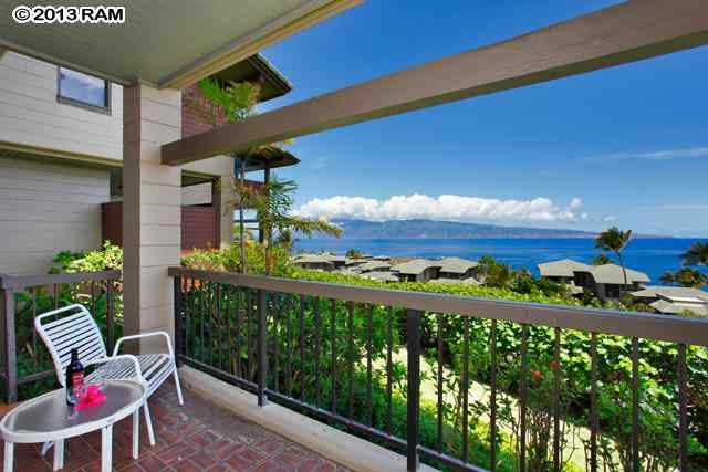a view of a chairs and table in patio
