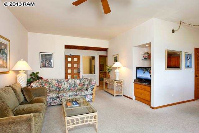 100 Ridge Road, Unit 2914 Lahaina, HI 96761 - Photo 11 of 24 a living room with furniture and a chandelier