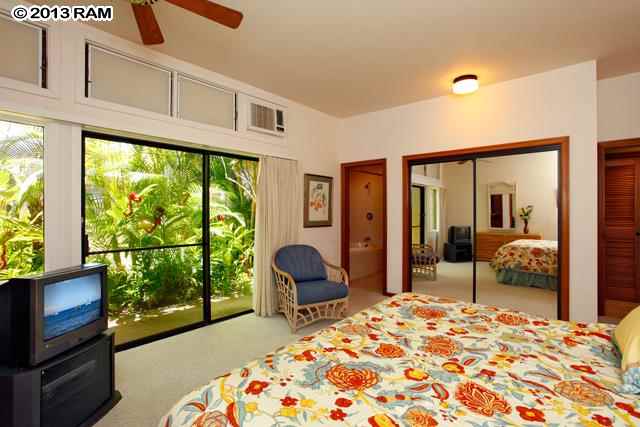 100 Ridge Road, Unit 2914 Lahaina, HI 96761 - Photo 13 of 24 a bedroom with a bed and large windows