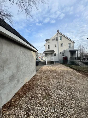 a view of a house with a backyard