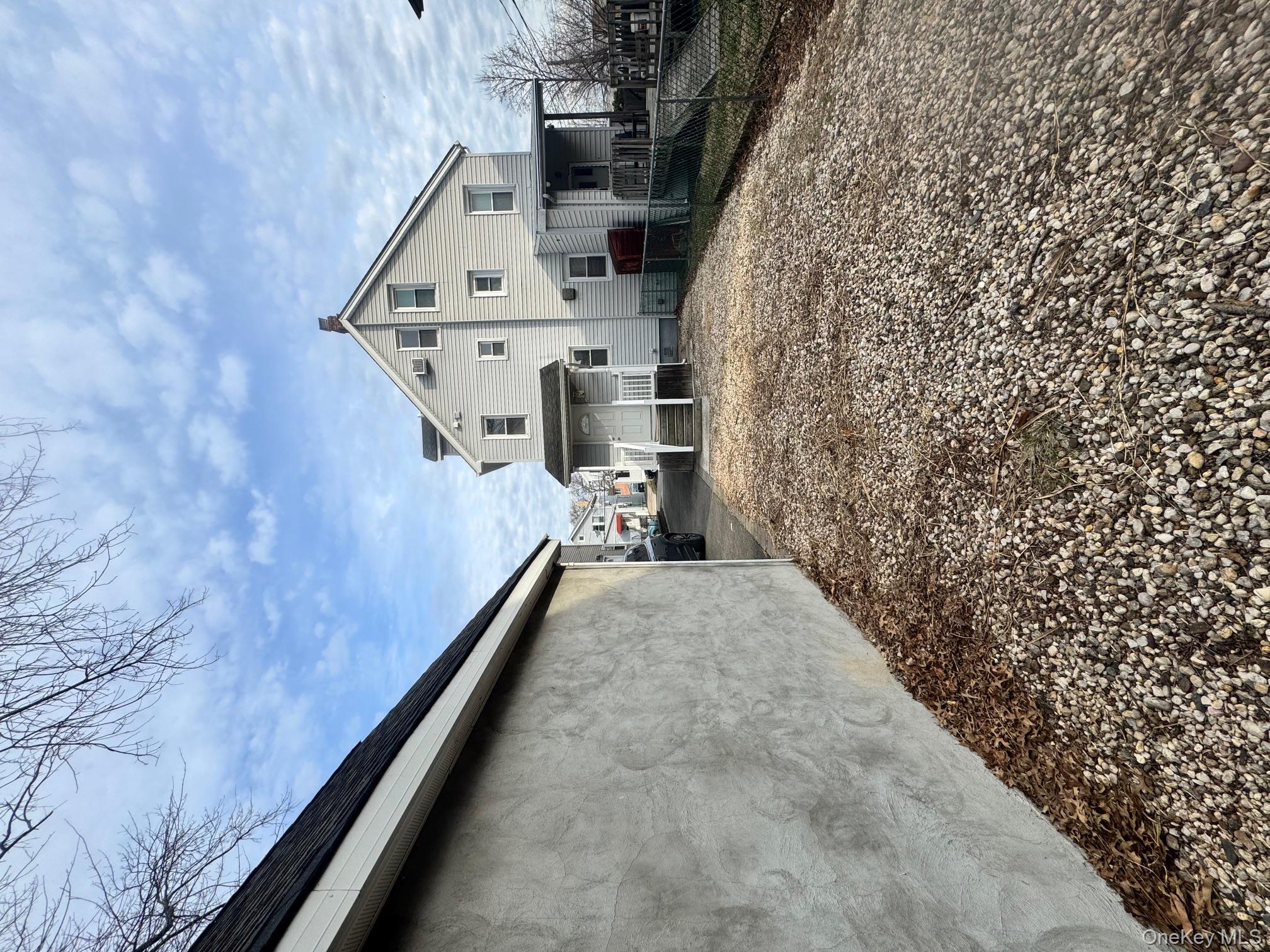 164-36 77th Road Queens, NY 11366 - Photo 20 of 20 a view of a house with a backyard