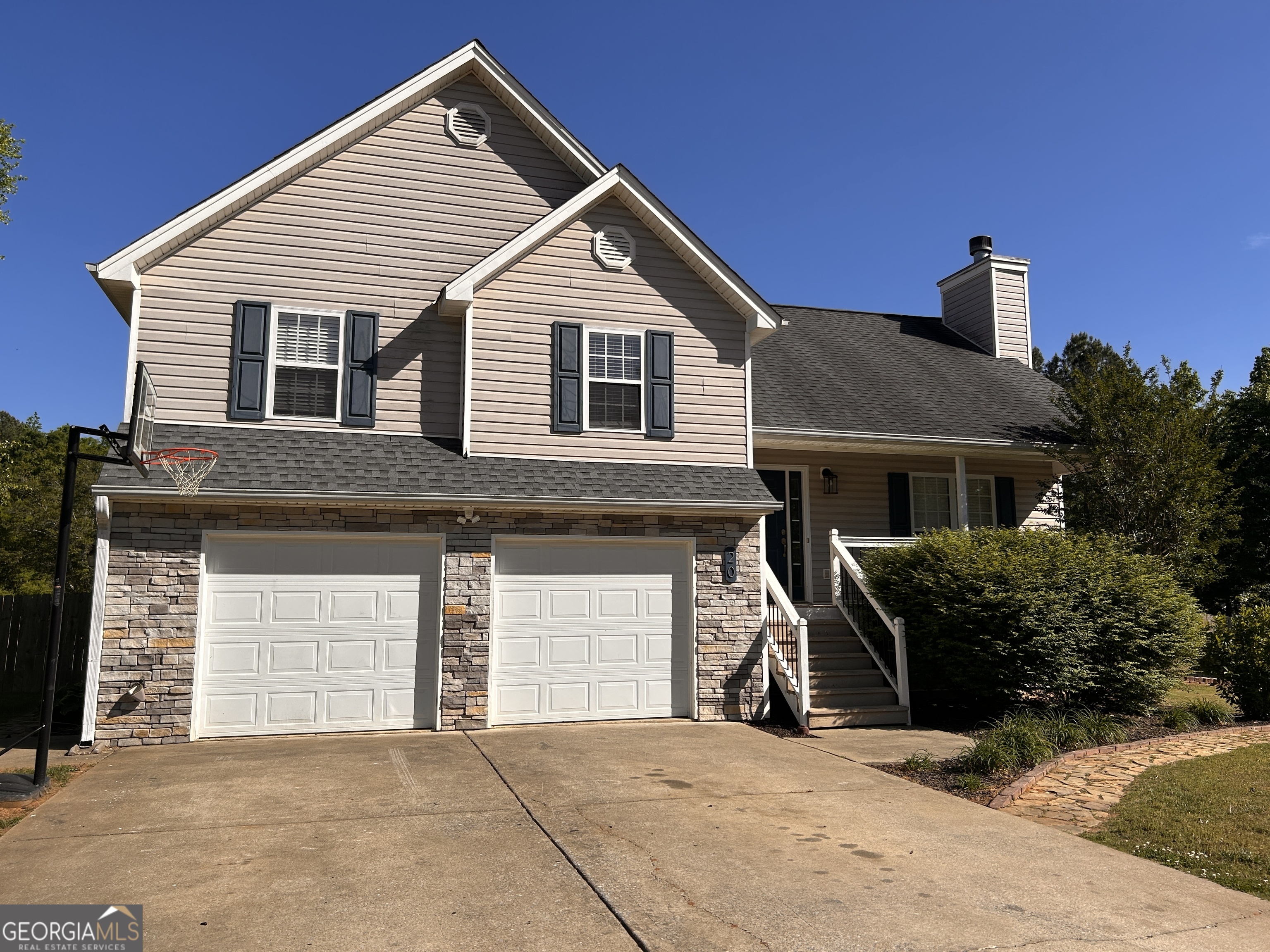 a front view of a house with a garage