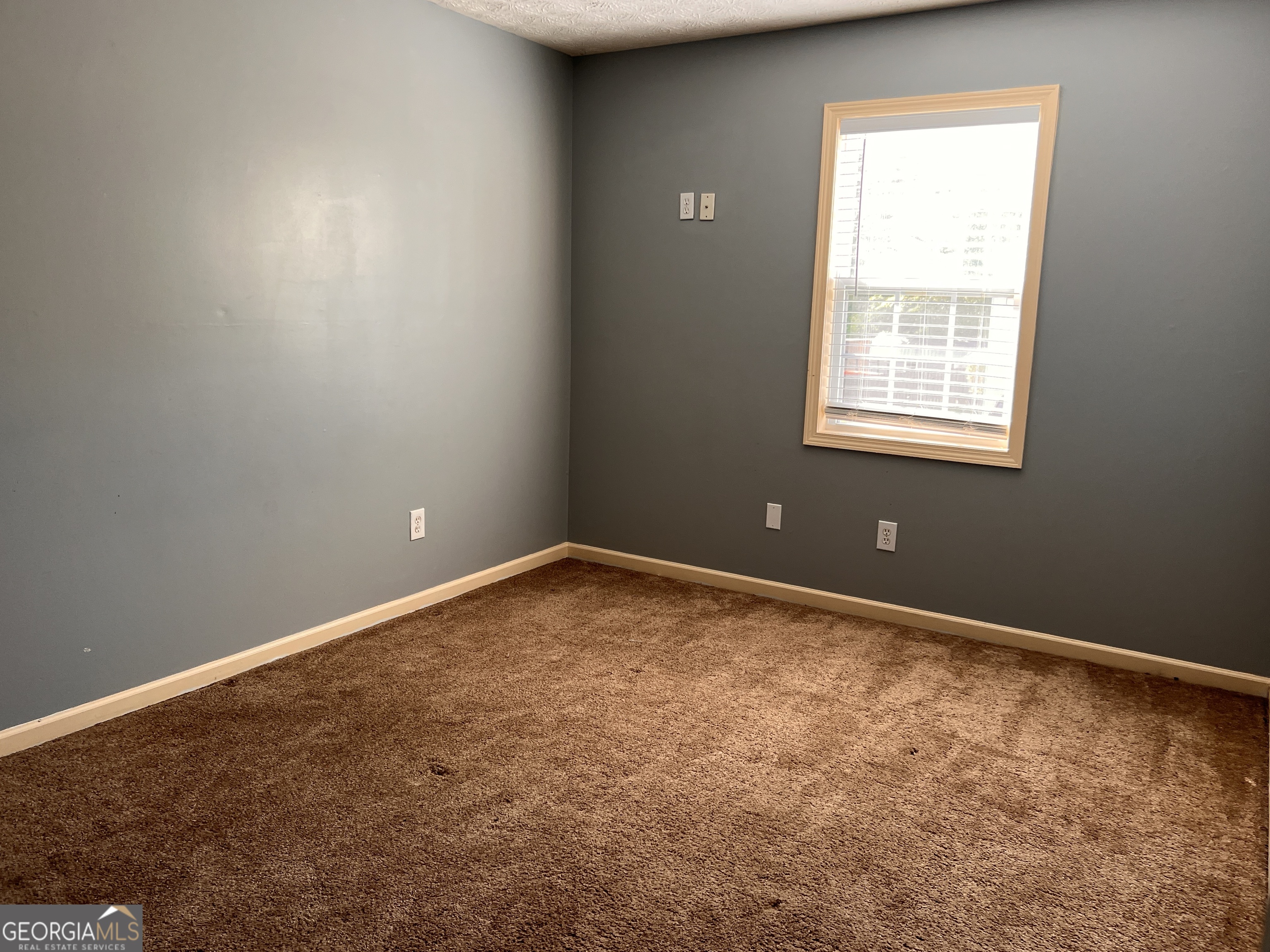 20 Triangle Lane Adairsville, GA 30103 - Photo 12 of 17 an empty room with a window