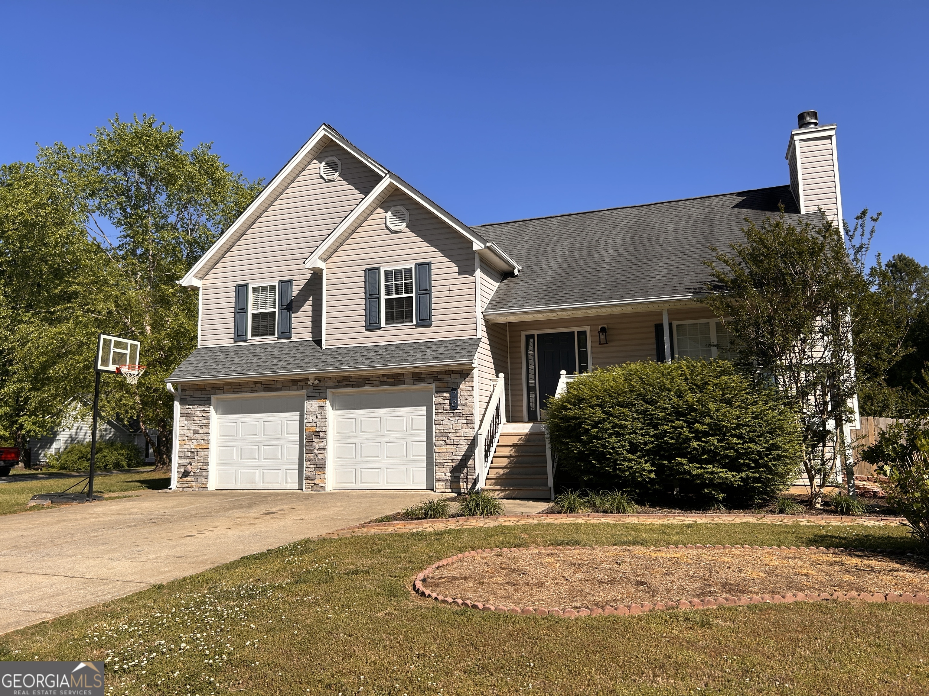 20 Triangle Lane Adairsville, GA 30103 - Photo 2 of 17 a front view of a house with a yard and garage